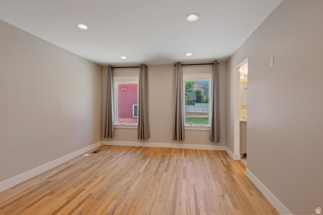 1214 North 300 West Mapleton, UT 84664 - Photo 11 of 33 Spacious Primary Bedroom with hardwood floors, recessed ceiling, new windows, walk-in closet and en suite bath.