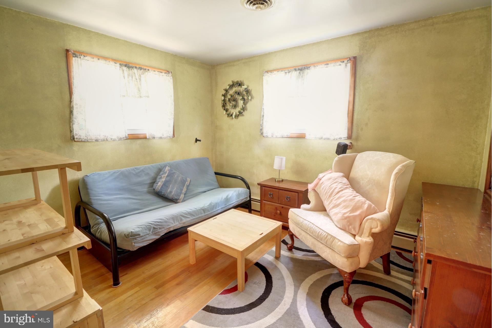 200 Burns Crossing Road Severn, MD 21144 - Photo 21 of 37 a living room with furniture a window and a table