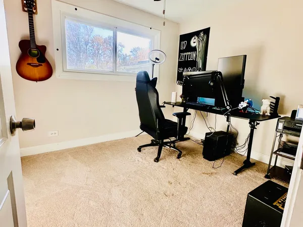 a bedroom with a bed and a dresser