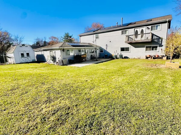 a view of a swimming pool with an outdoor space and seating area
