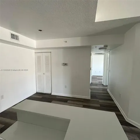 a view of wooden floor in an empty room