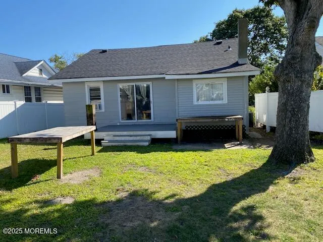 a view of a house with pool and a yard