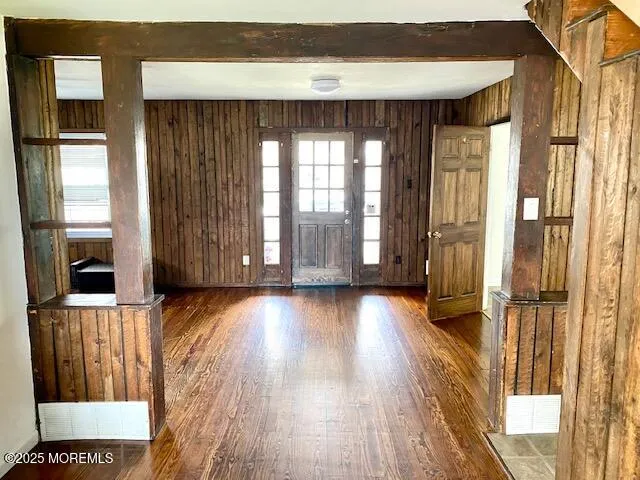 a view of front door with wooden floor