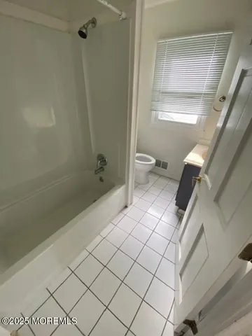 a bathroom with a sink and a shower