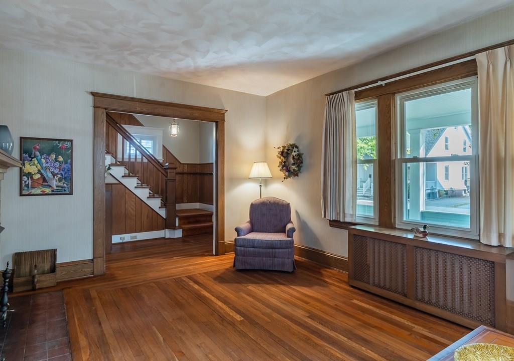 38 Castle Street Springfield, MA 01118 - Photo 11 of 41 a living room with furniture and a large window