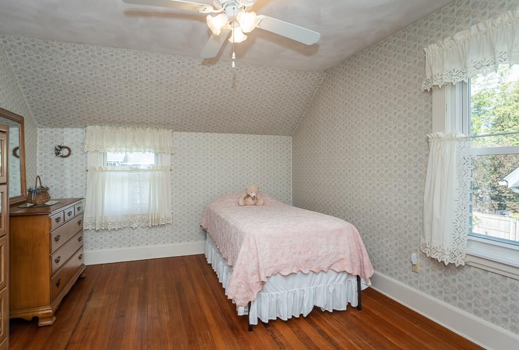 38 Castle Street Springfield, MA 01118 - Photo 26 of 41 a bedroom with a bed and a chandelier