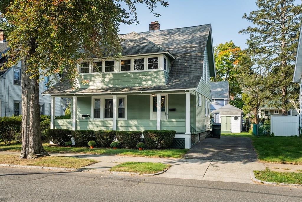 38 Castle Street Springfield, MA 01118 - Photo 3 of 41 a front view of a house with a yard and potted plants