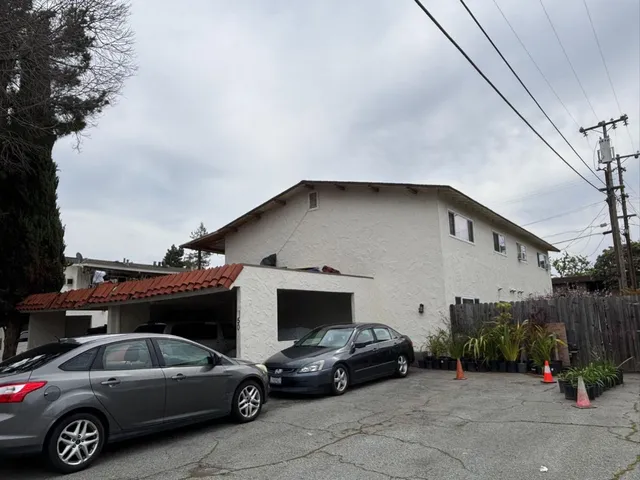 a view of a car parked in front of a house