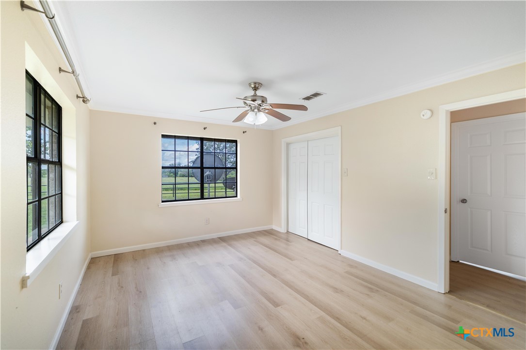1033 Farm To Market 1351 Goliad, TX 77963 - Photo 17 of 34 wooden floor in an empty room with a window
