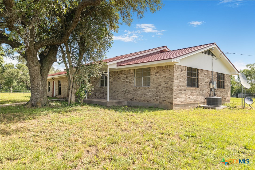 1033 Farm To Market 1351 Goliad, TX 77963 - Photo 22 of 34 a view of a house with a yard and swimming pool