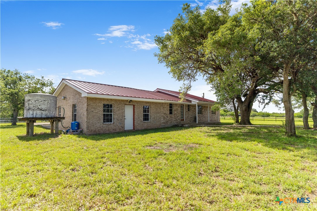 1033 Farm To Market 1351 Goliad, TX 77963 - Photo 23 of 34 a view of a house with a yard