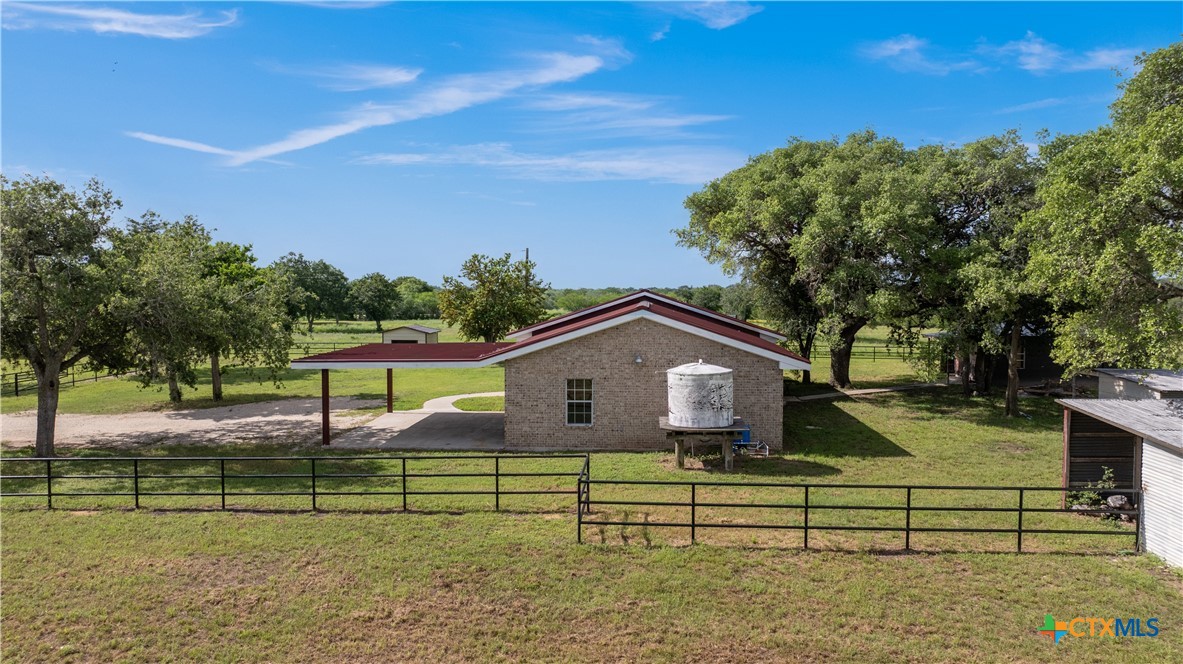 1033 Farm To Market 1351 Goliad, TX 77963 - Photo 24 of 34 a front view of a house with a yard