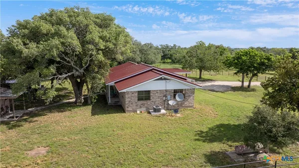 a house with trees in the background