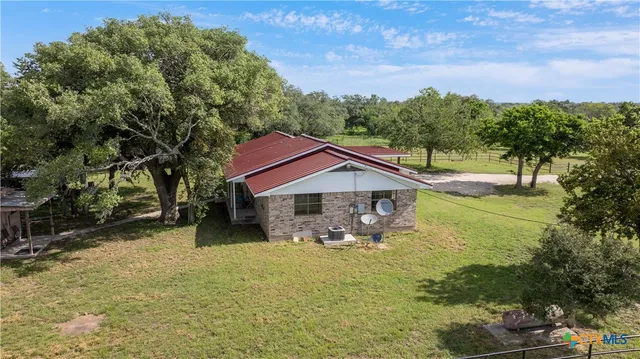 a house with trees in the background
