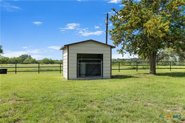 a view of a yard with an outdoor space