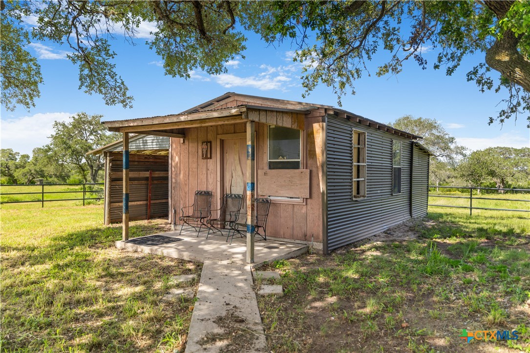 1033 Farm To Market 1351 Goliad, TX 77963 - Photo 29 of 34 a view of a house with a yard