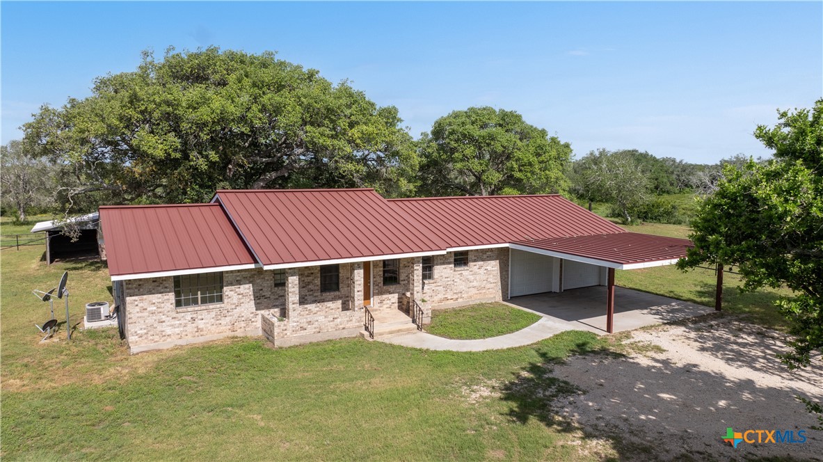 1033 Farm To Market 1351 Goliad, TX 77963 - Photo 6 of 34 a backyard of a house with table and chairs