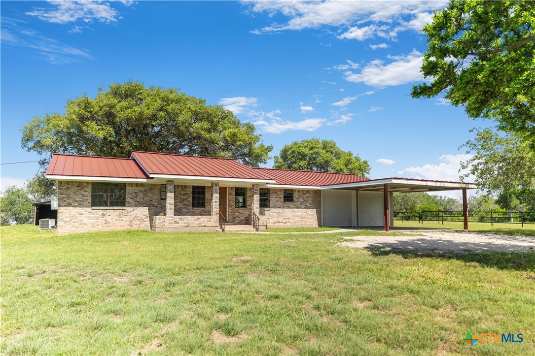 1033 Farm To Market 1351 Goliad, TX 77963 - Photo 8 of 34 a view of a house with a yard