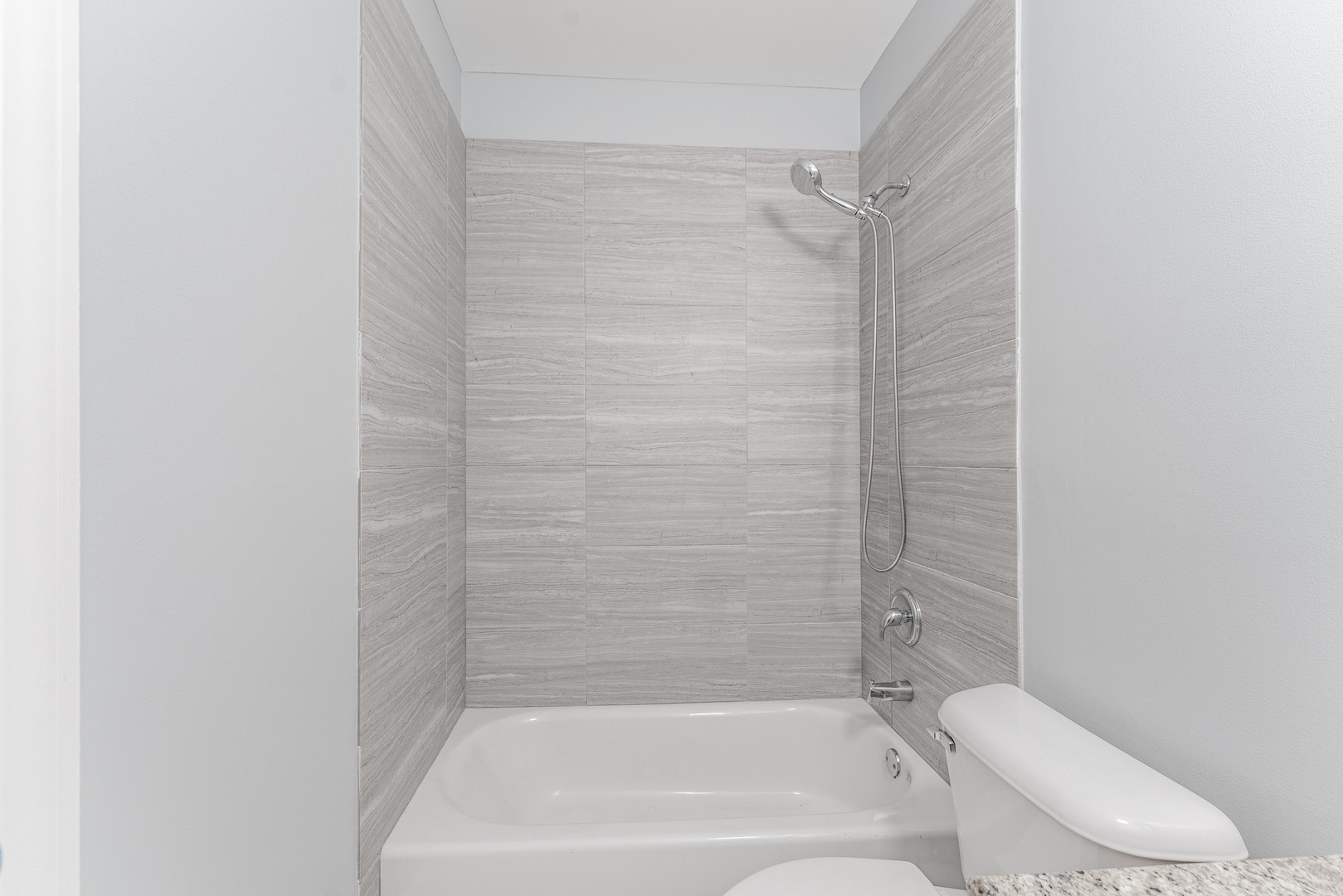 4011 West Fullerton Avenue, Unit 2E Chicago, IL 60639 - Photo 18 of 32 a bathroom with a bathtub and a toilet