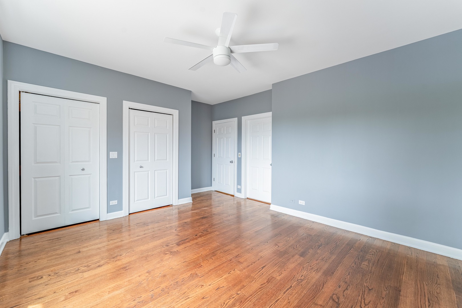 4011 West Fullerton Avenue, Unit 2E Chicago, IL 60639 - Photo 20 of 32 a view of an empty room with wooden floor