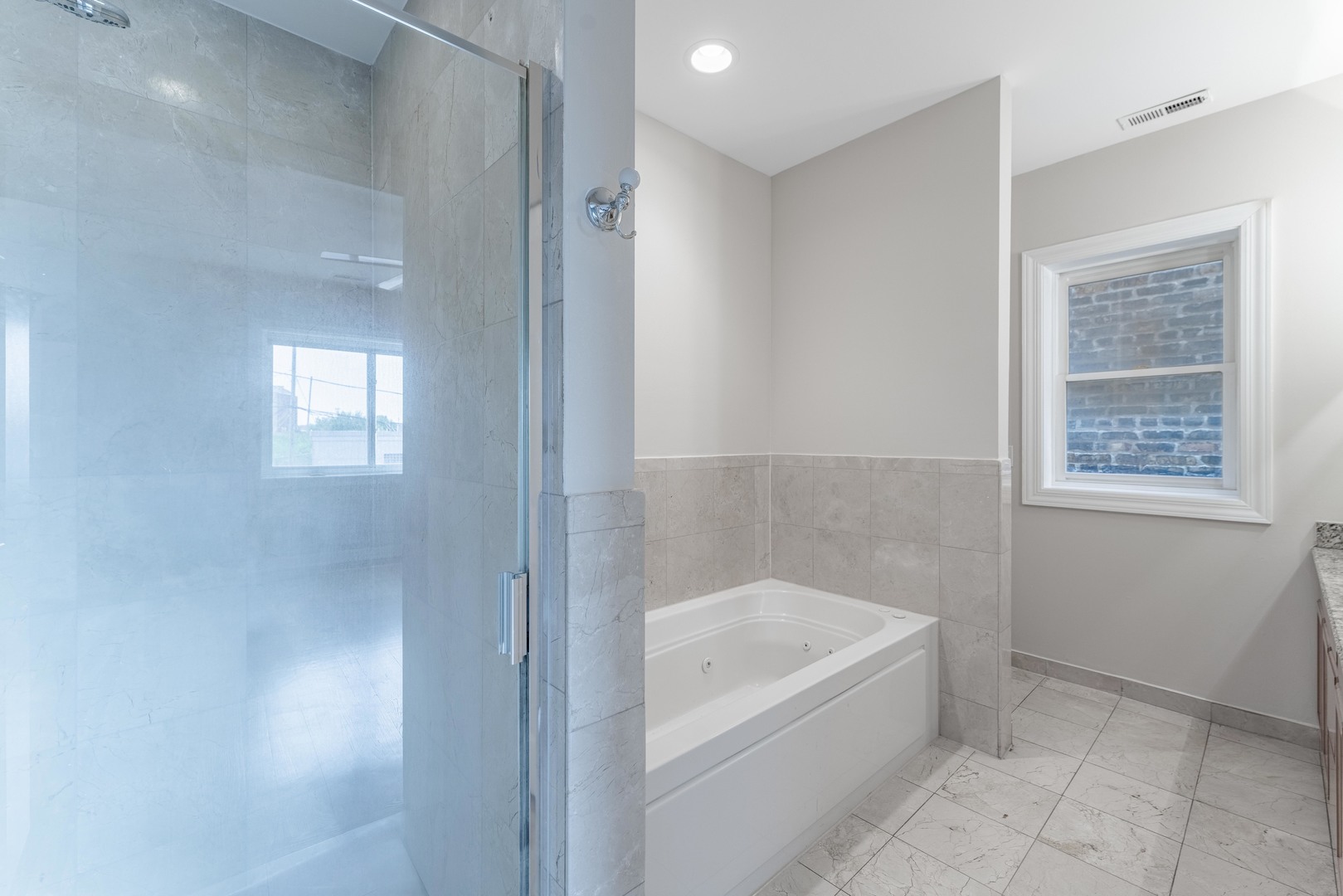 4011 West Fullerton Avenue, Unit 2E Chicago, IL 60639 - Photo 21 of 32 a bathroom with a bathtub and shower