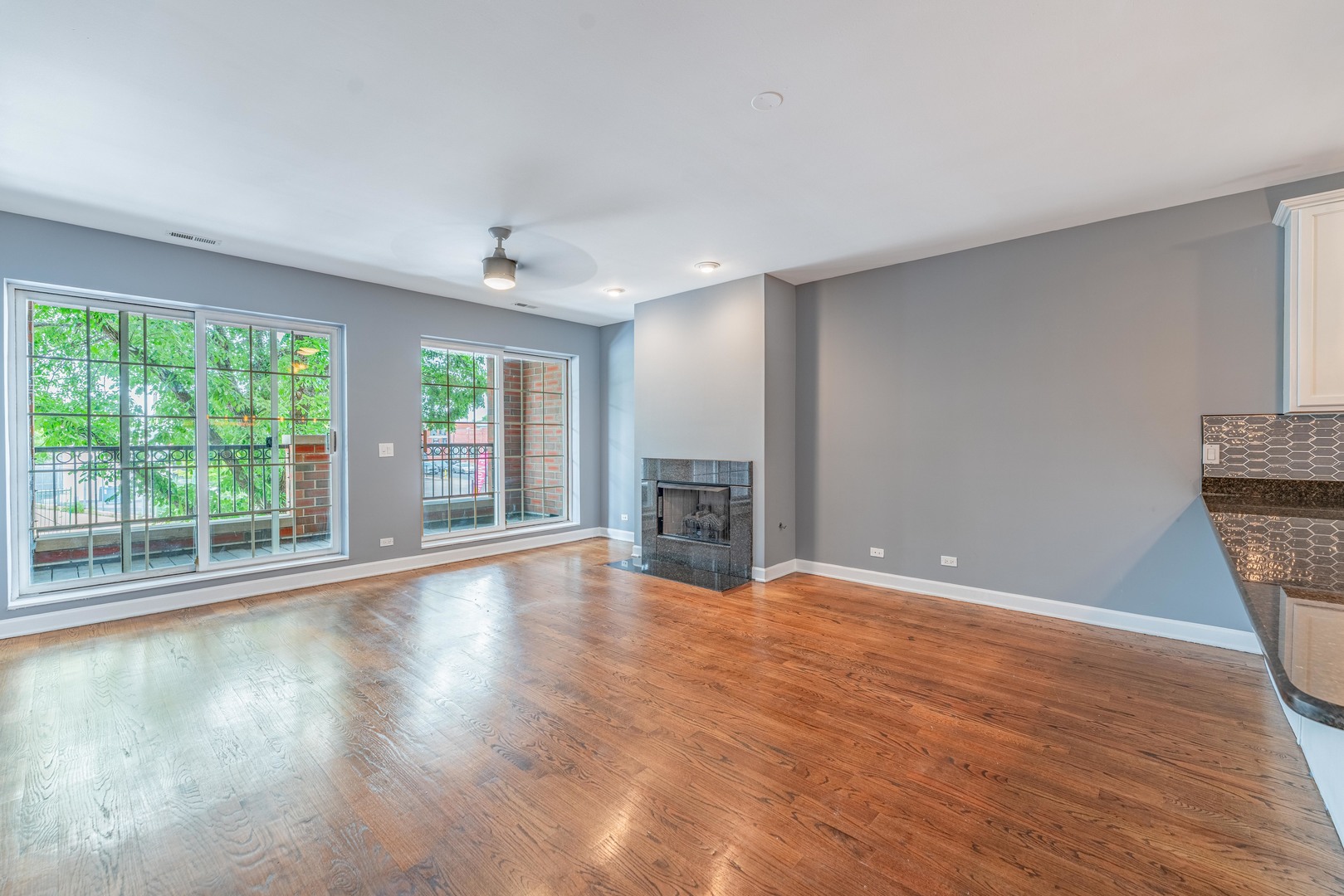 4011 West Fullerton Avenue, Unit 2E Chicago, IL 60639 - Photo 8 of 32 a view of an empty room with wooden floor and a window