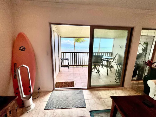 a view of living room with furniture and a flat screen tv