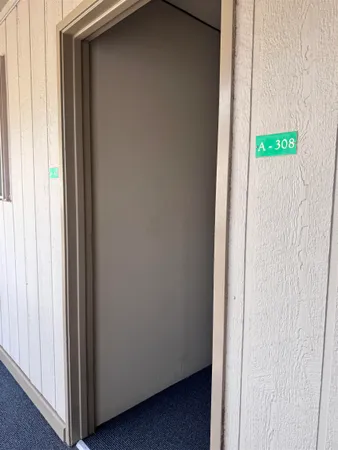a view of an entryway with a hallway