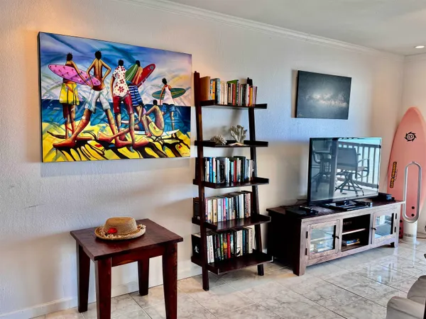 a room with bookshelf and a wooden floor