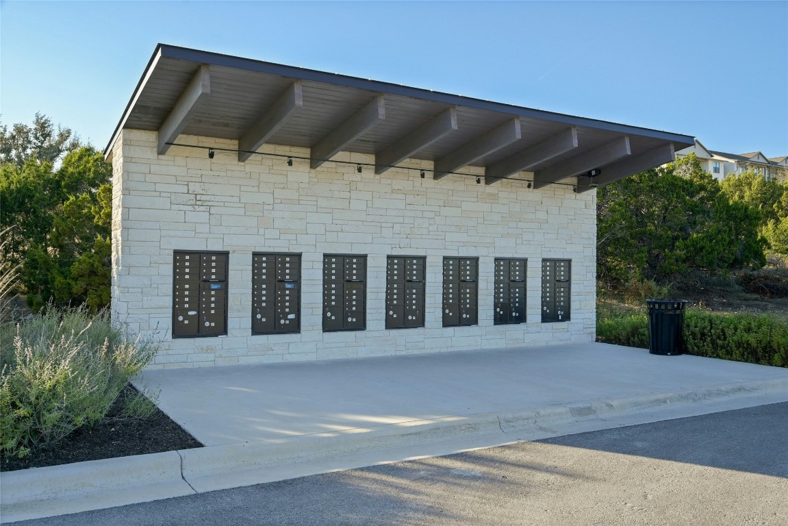 5905 Madrone Tree Lane Austin, TX 78738 - Photo 11 of 25 a front view of a house with a garden
