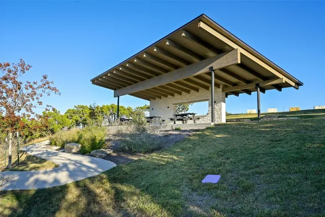 an aerial view of a house with a lake view
