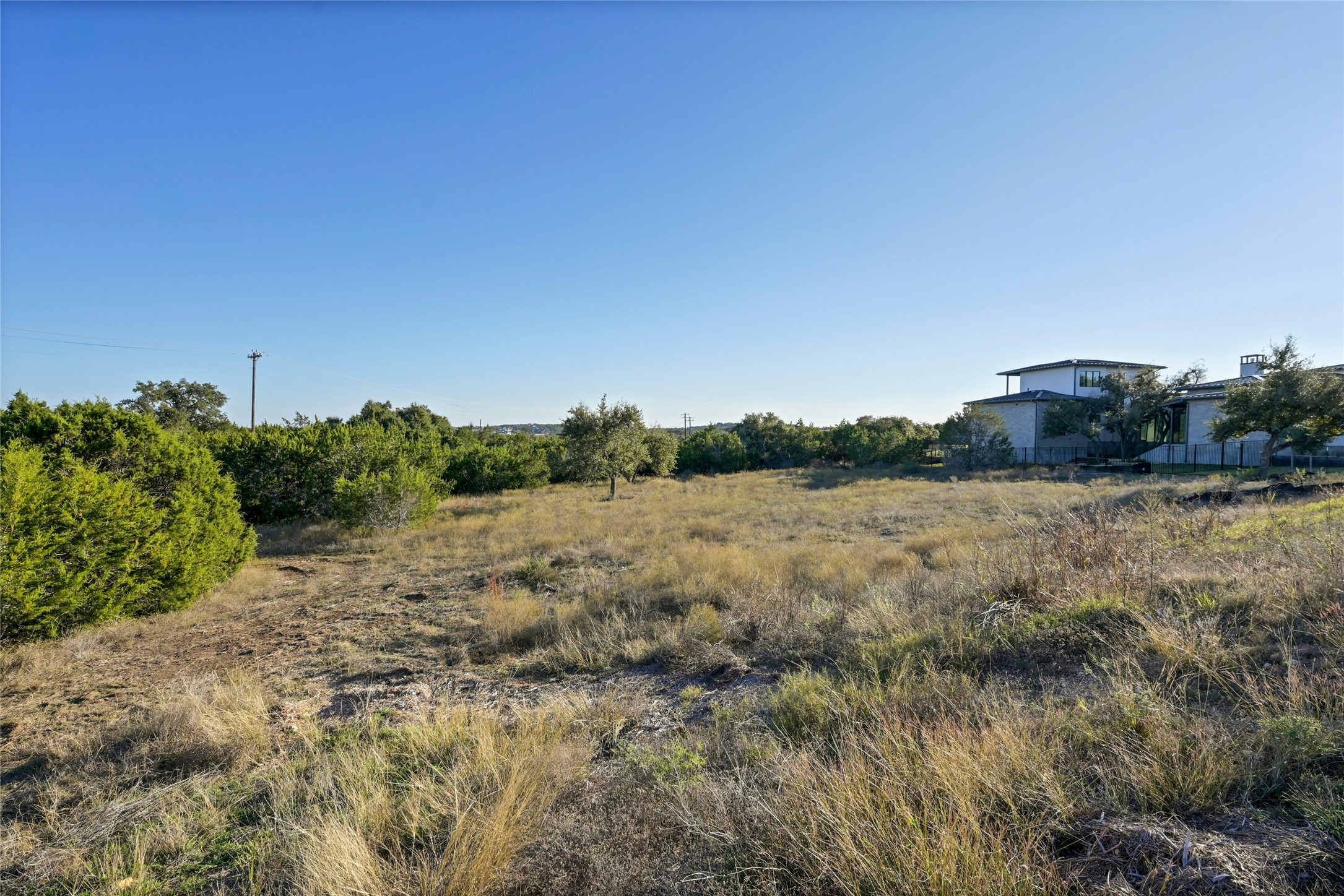 5905 Madrone Tree Lane Austin, TX 78738 - Photo 3 of 25 a view of a dry yard with wooden fence
