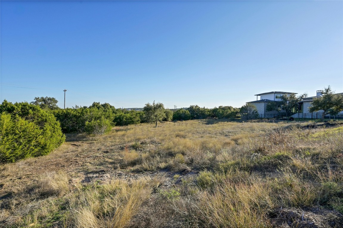 5905 Madrone Tree Lane Austin, TX 78738 - Photo 3 of 25 a view of a dry yard with wooden fence