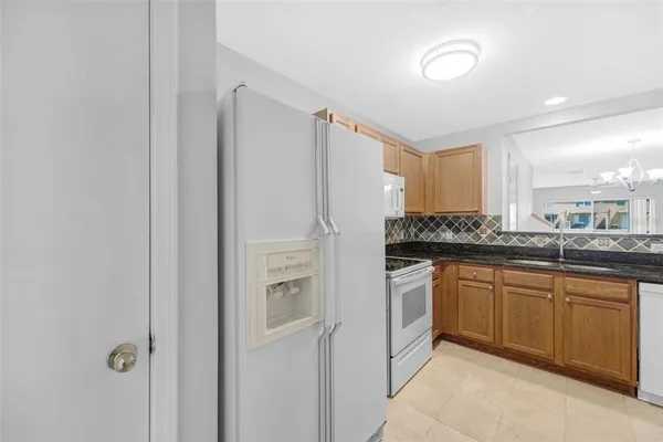 a view of a kitchen with washer and dryer