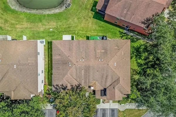 an aerial view of a house with outdoor space