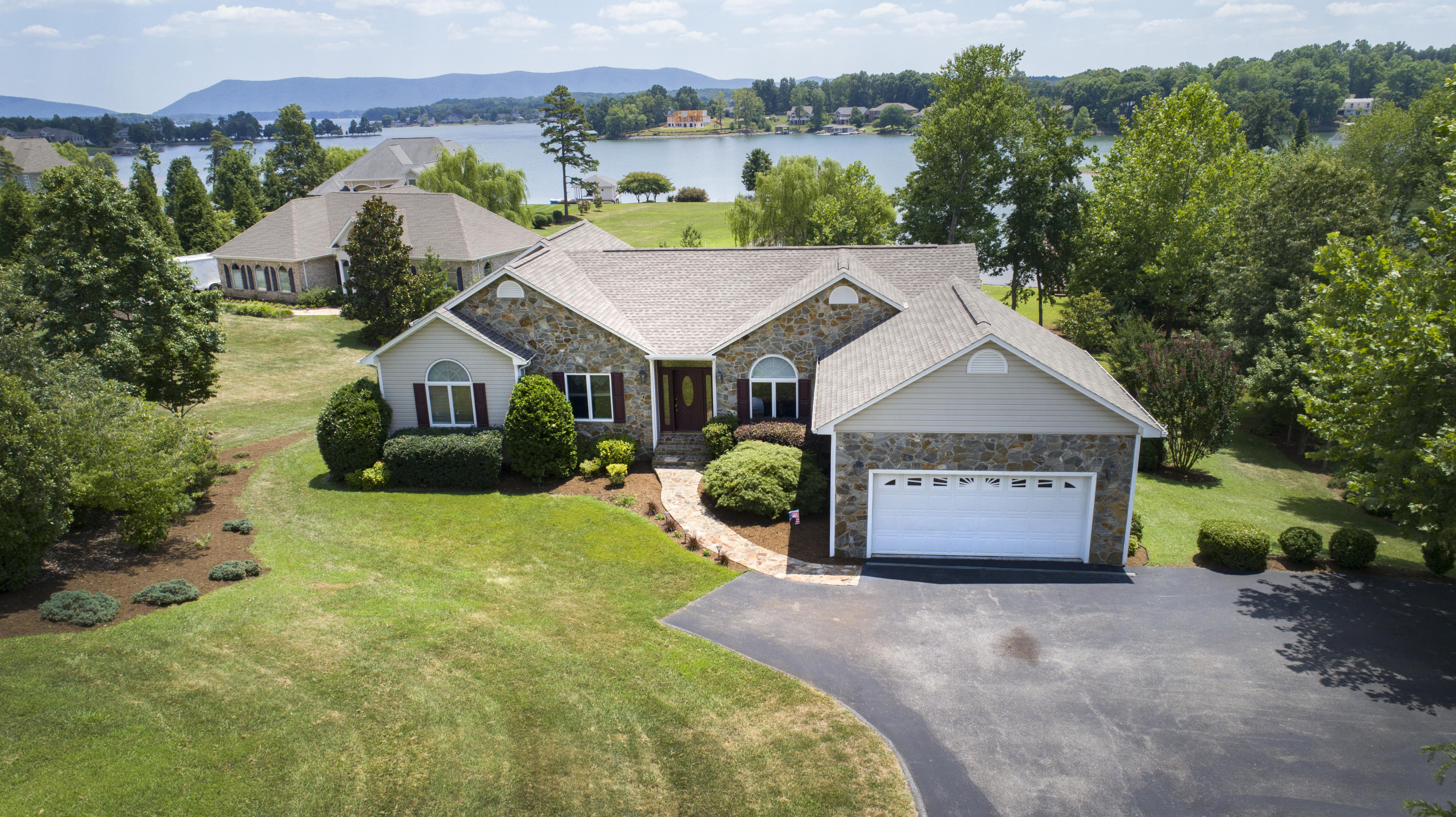 270 Calypso Road Moneta, VA 24121 - Photo 2 of 35 a view of a house with a yard and potted plants