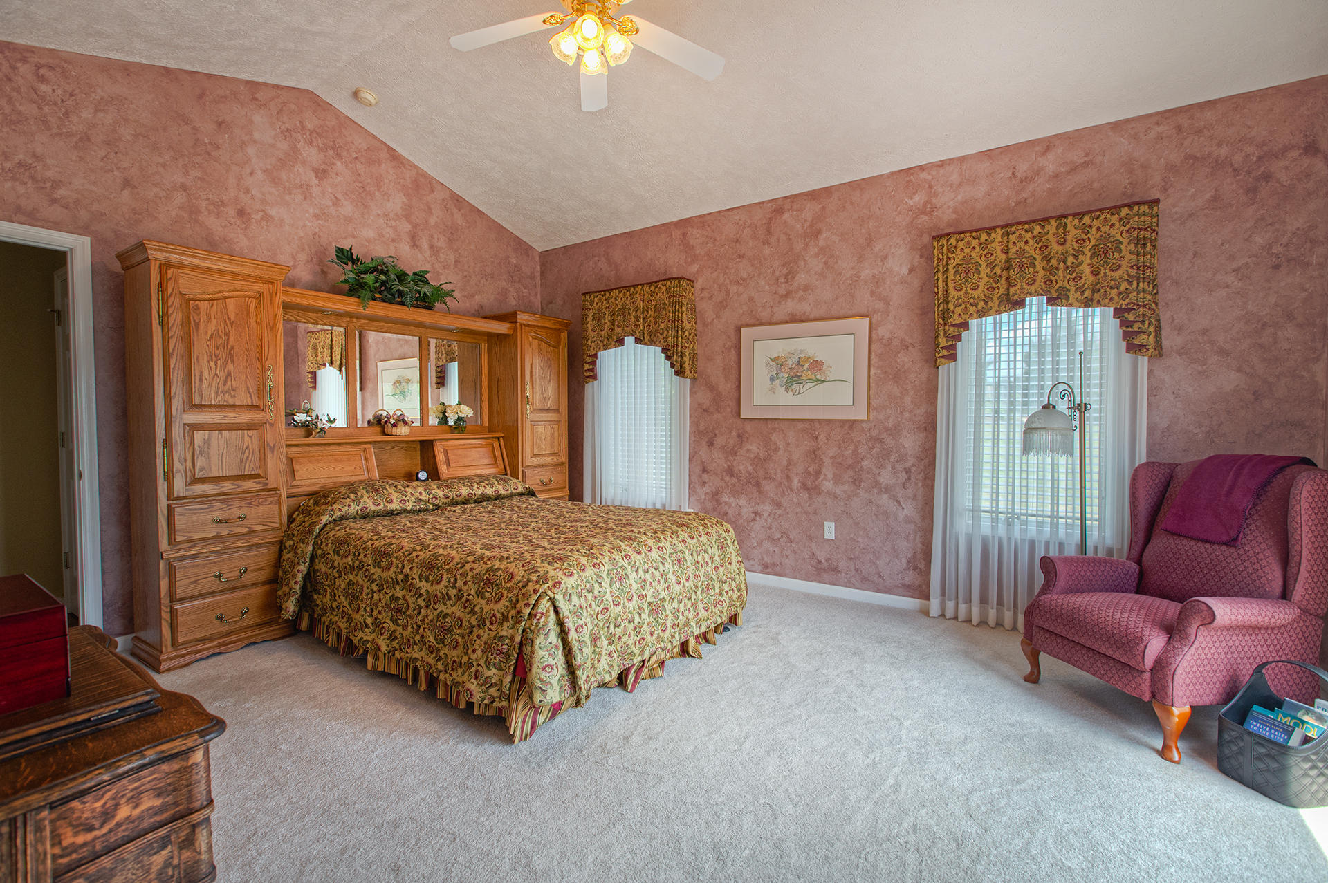 270 Calypso Road Moneta, VA 24121 - Photo 12 of 35 a bedroom with a bed and a chandelier