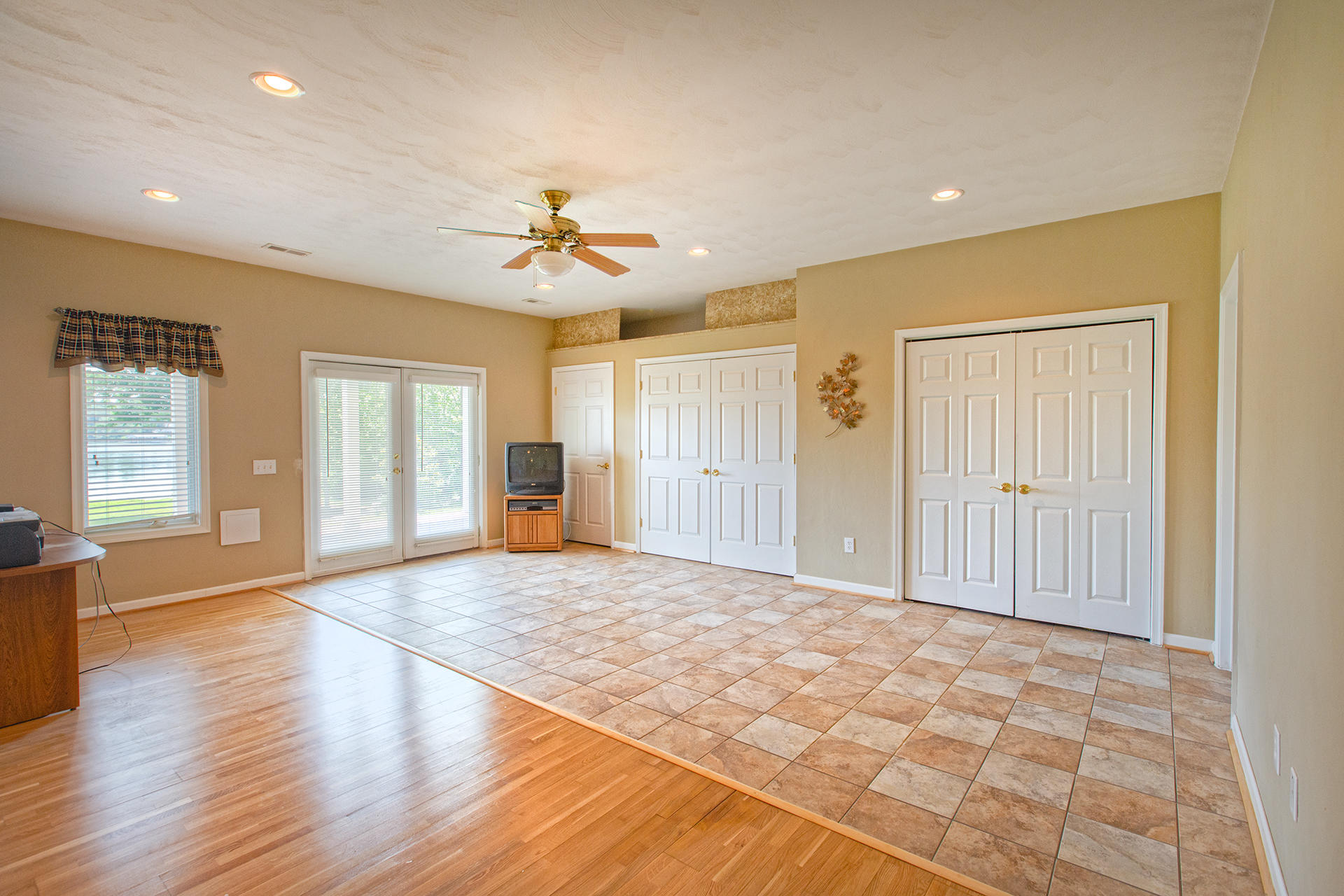 270 Calypso Road Moneta, VA 24121 - Photo 18 of 35 a view of an empty room with window and wooden floor