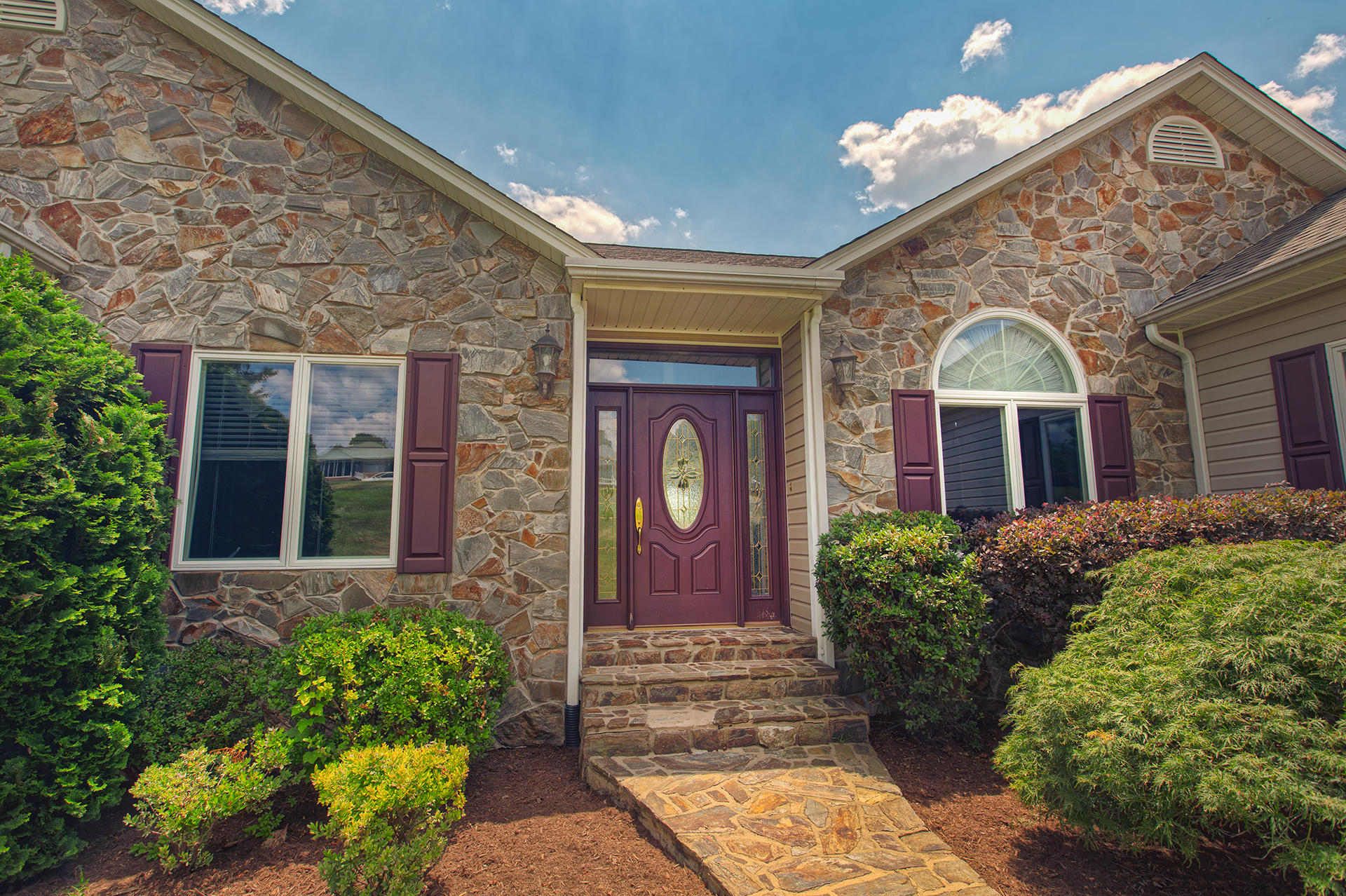 270 Calypso Road Moneta, VA 24121 - Photo 20 of 35 front view of a brick house with a large windows