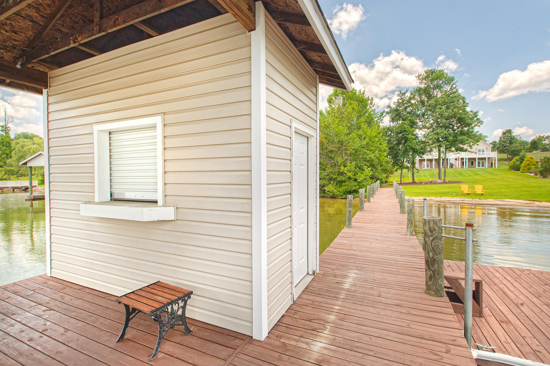 270 Calypso Road Moneta, VA 24121 - Photo 30 of 35 a view of a house with backyard and wooden deck