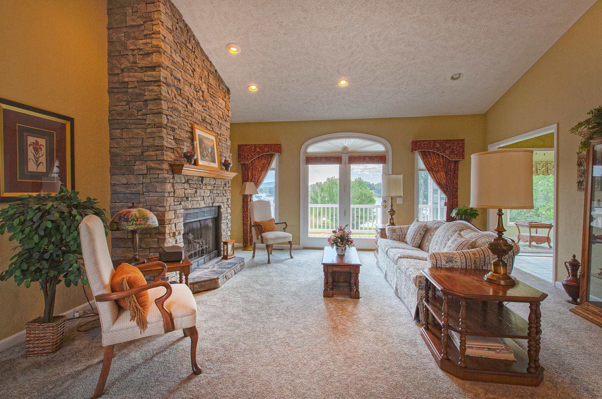 270 Calypso Road Moneta, VA 24121 - Photo 4 of 35 a living room with furniture and a floor to ceiling window