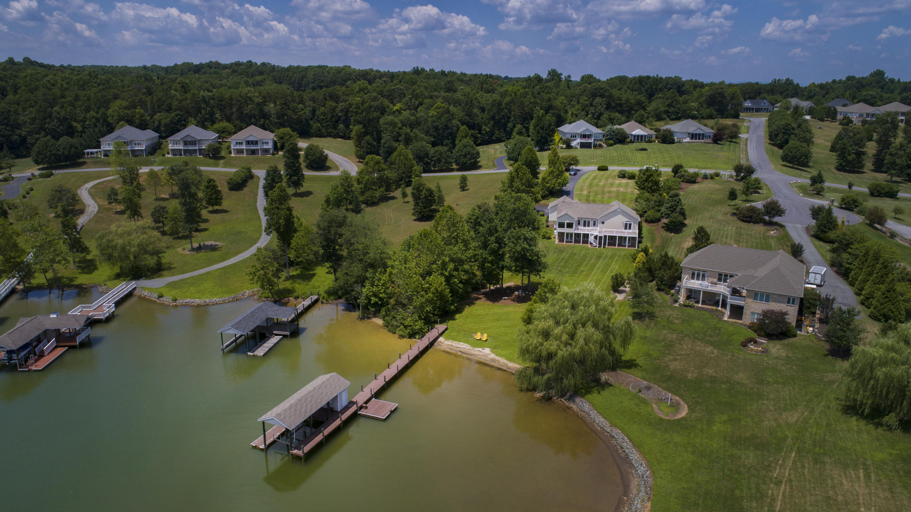 270 Calypso Road Moneta, VA 24121 - Photo 34 of 35 an aerial view of lake residential houses with outdoor space and swimming pool