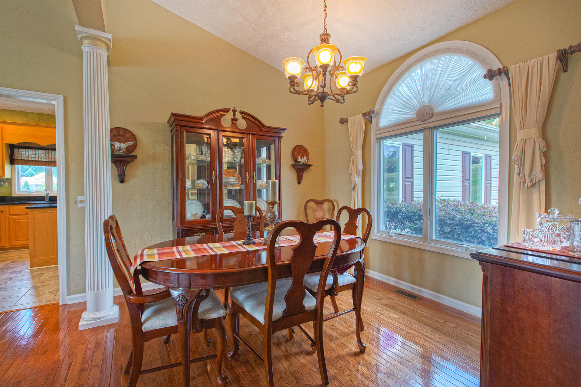 270 Calypso Road Moneta, VA 24121 - Photo 9 of 35 a view of a dining room with furniture a chandelier and wooden floor