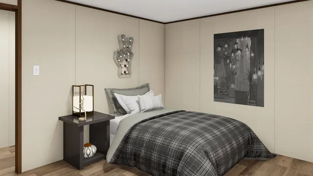 a bedroom with a bed and painting on the wall
