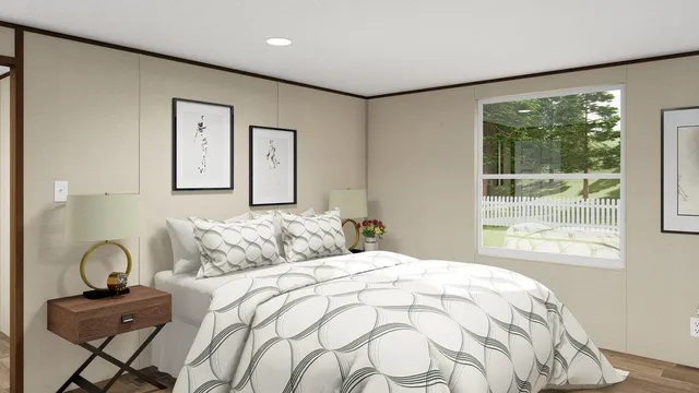 a bedroom with a bed and a large window