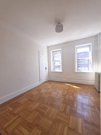 a view of an empty room with windows