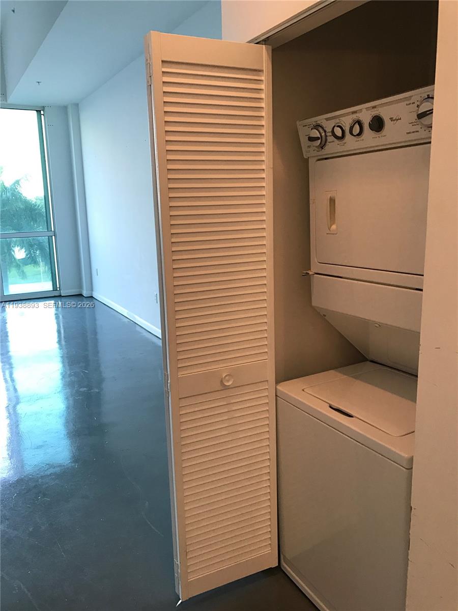 253 Northeast 2nd Street, Unit 333 Miami, FL 33132 - Photo 12 of 20 a utility room with dryer and washer