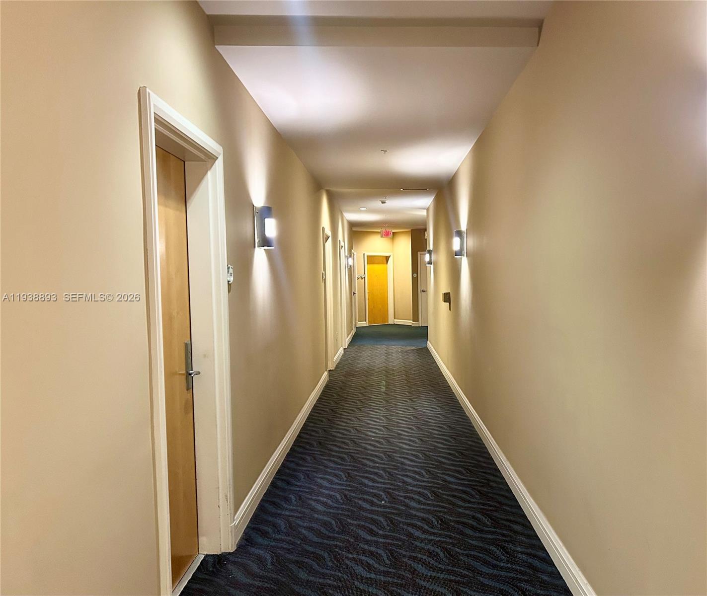 253 Northeast 2nd Street, Unit 333 Miami, FL 33132 - Photo 15 of 20 a view of a hallway with wooden floor
