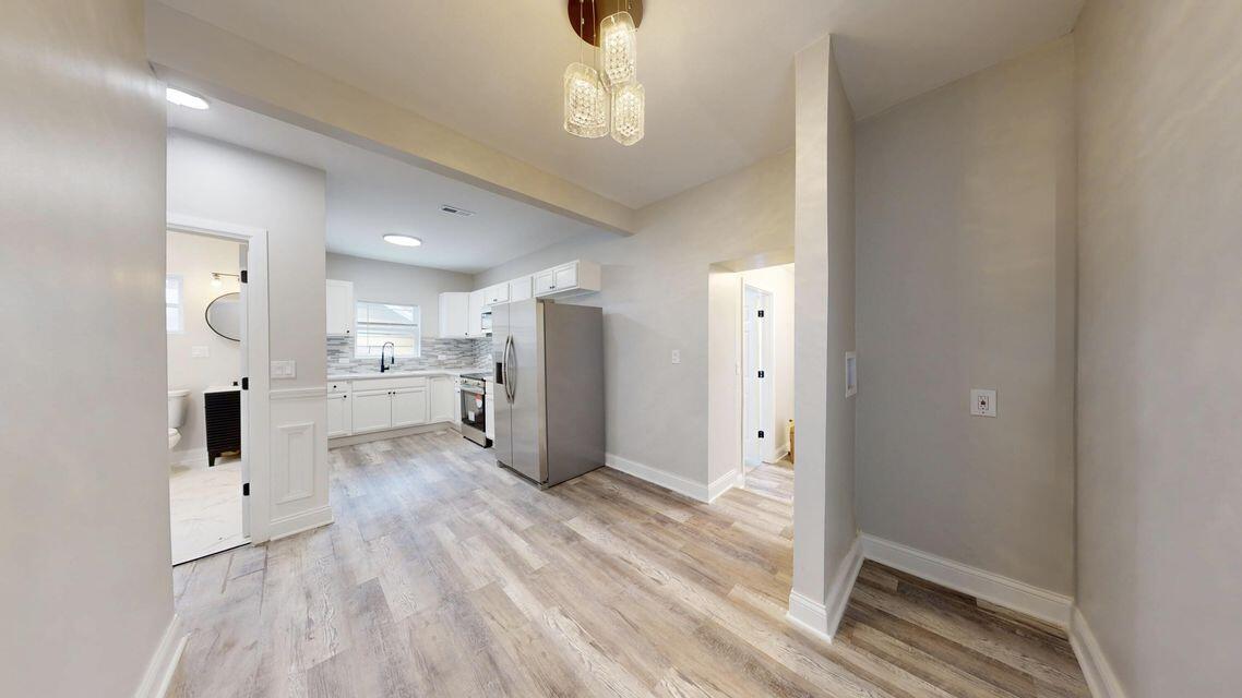 1379 Roosevelt Place, Unit 1 Gary, IN 46404 - Photo 15 of 24 a view of a kitchen with wooden floor
