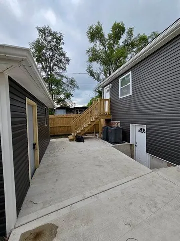 a view of the house with a yard